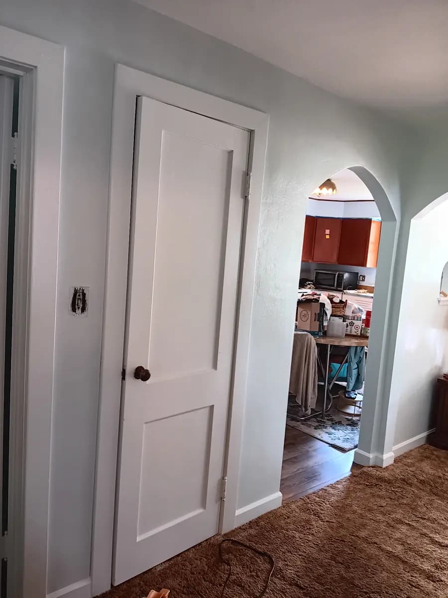 Repainted hallway arch and walls in the finished color.