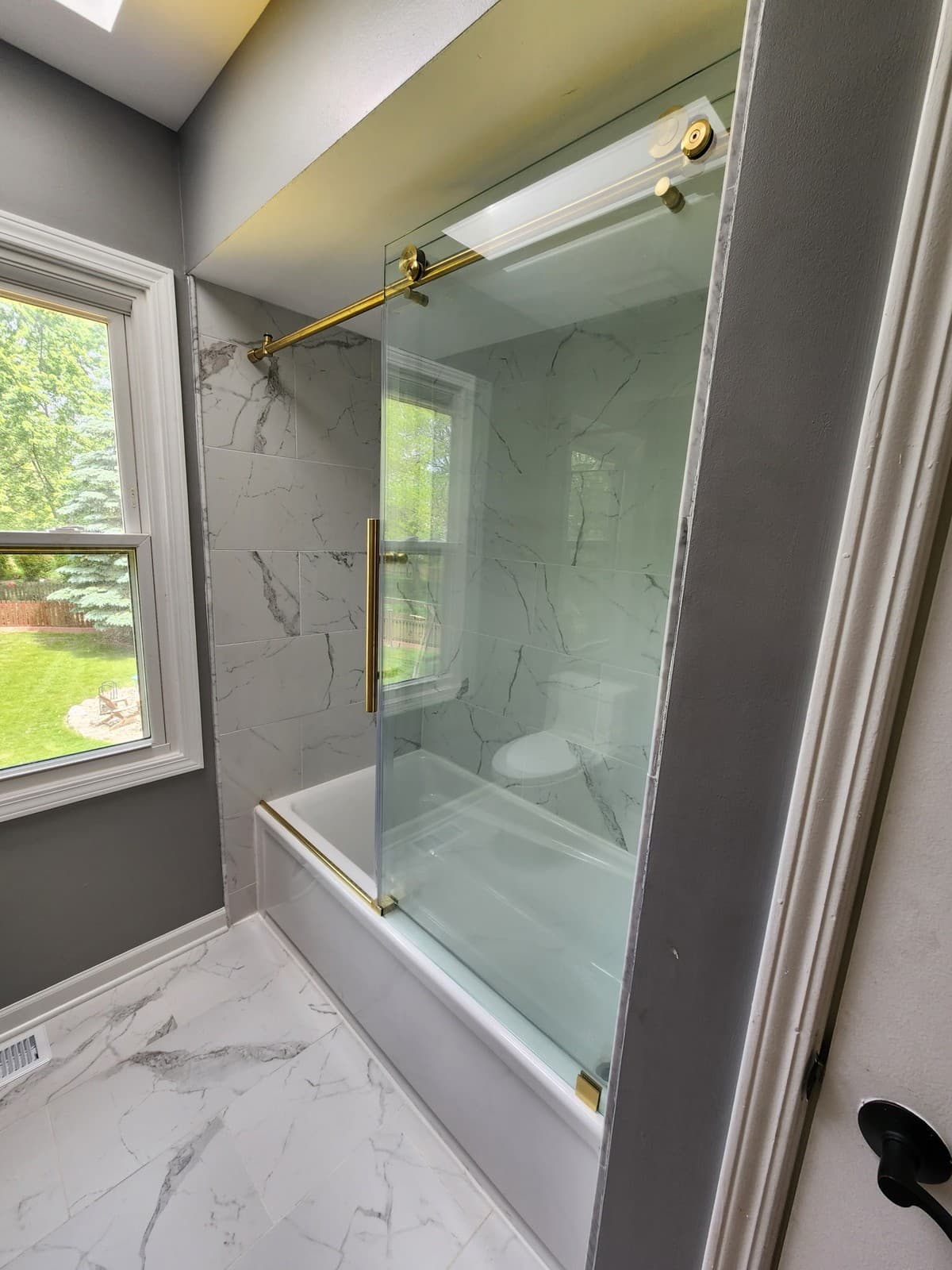 Completed bathroom renovation in Hinsdale with double vanity and finished fixtures.