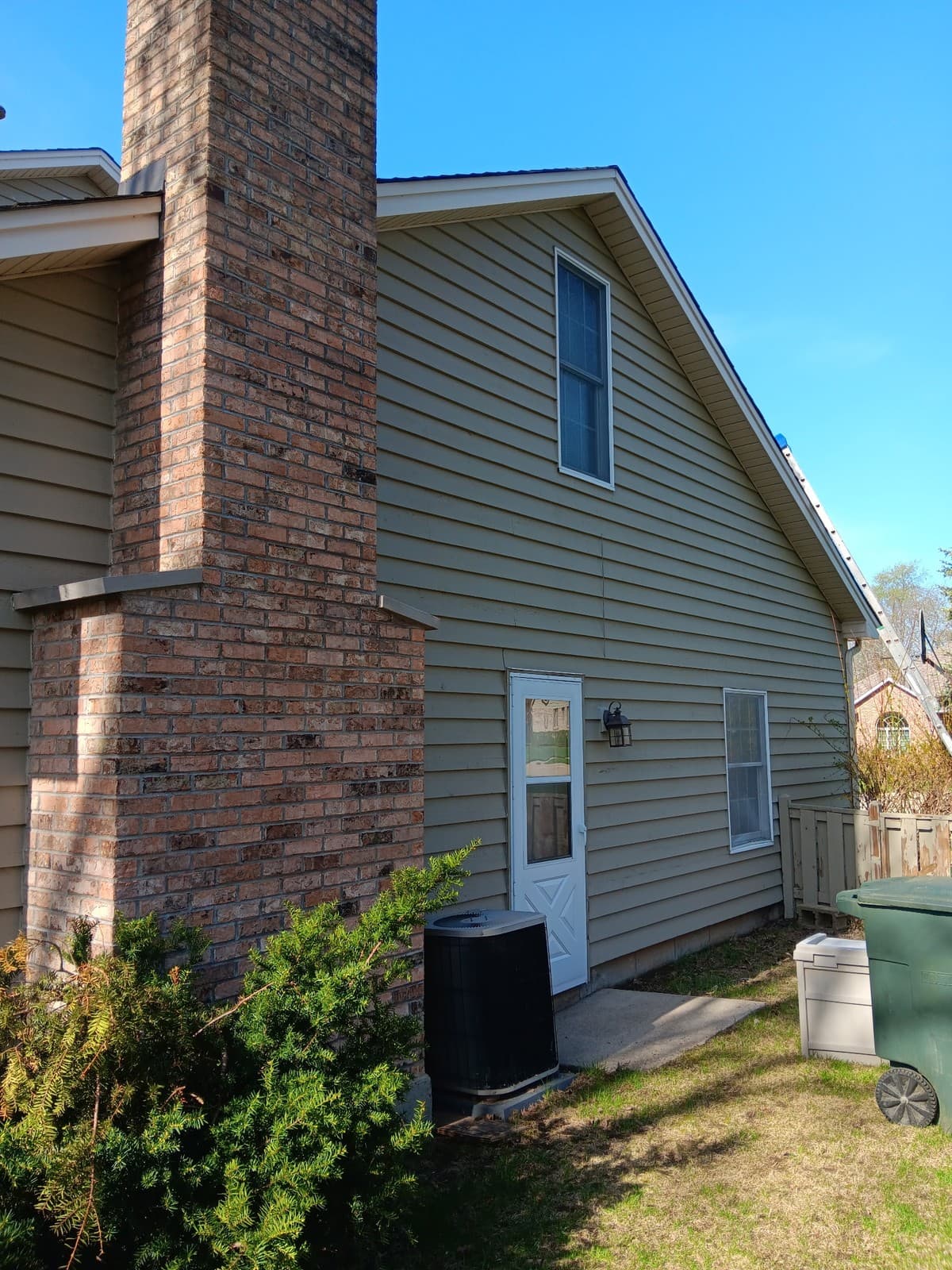 Completed exterior siding repaint on a two-story home in Elgin.
