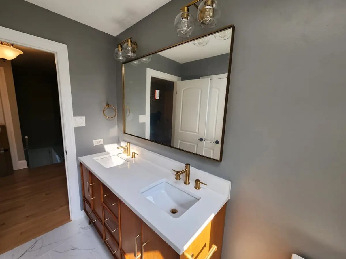 Landscape view of the completed double vanity and mirror wall.