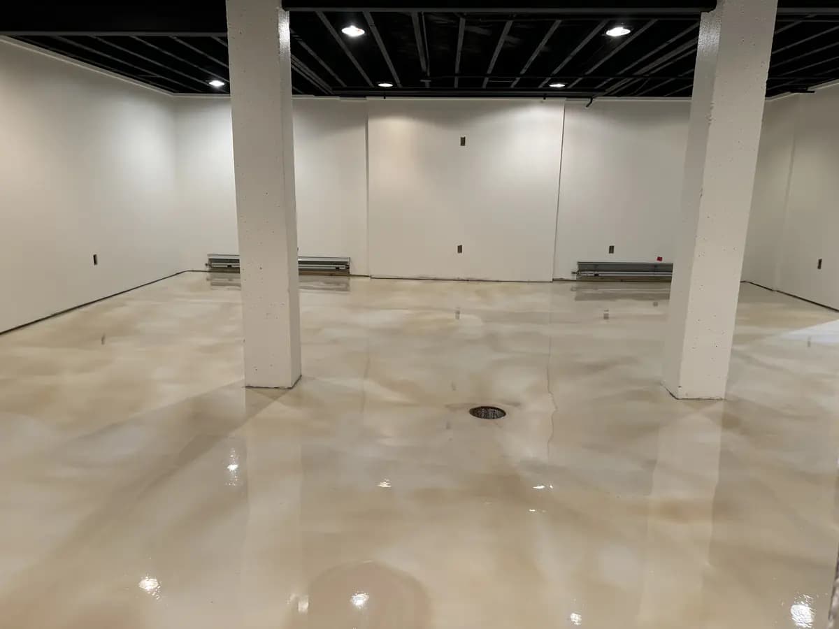 Commercial interior with a completed cream metallic epoxy floor.