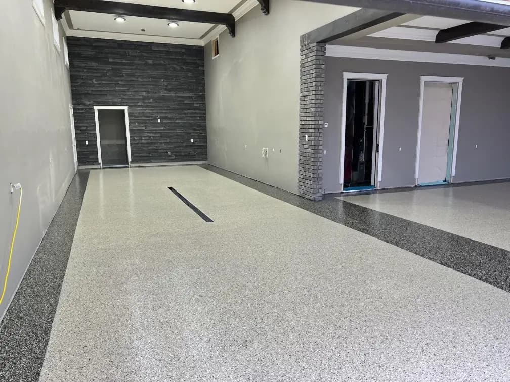 Wide commercial interior with a completed flake epoxy floor.