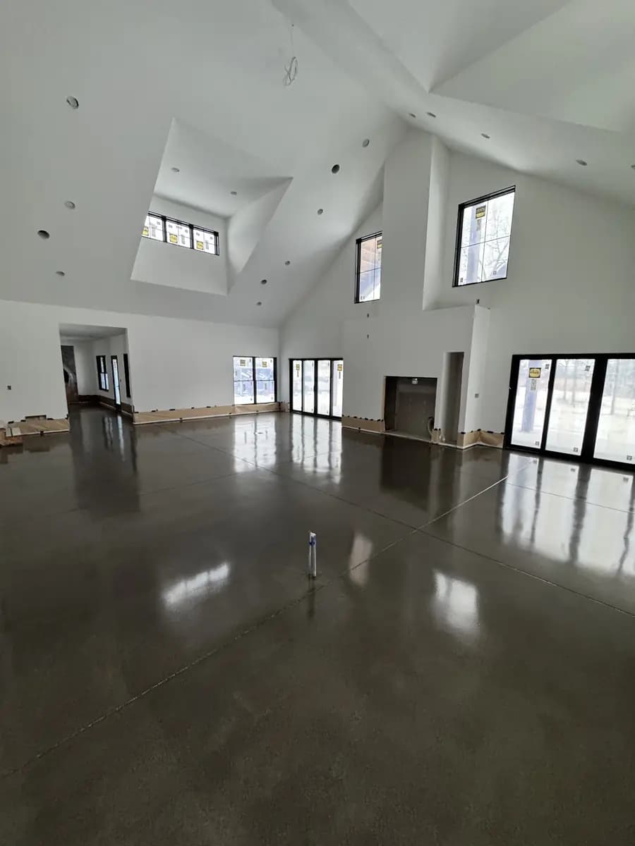 Large interior room with a completed charcoal metallic epoxy floor.