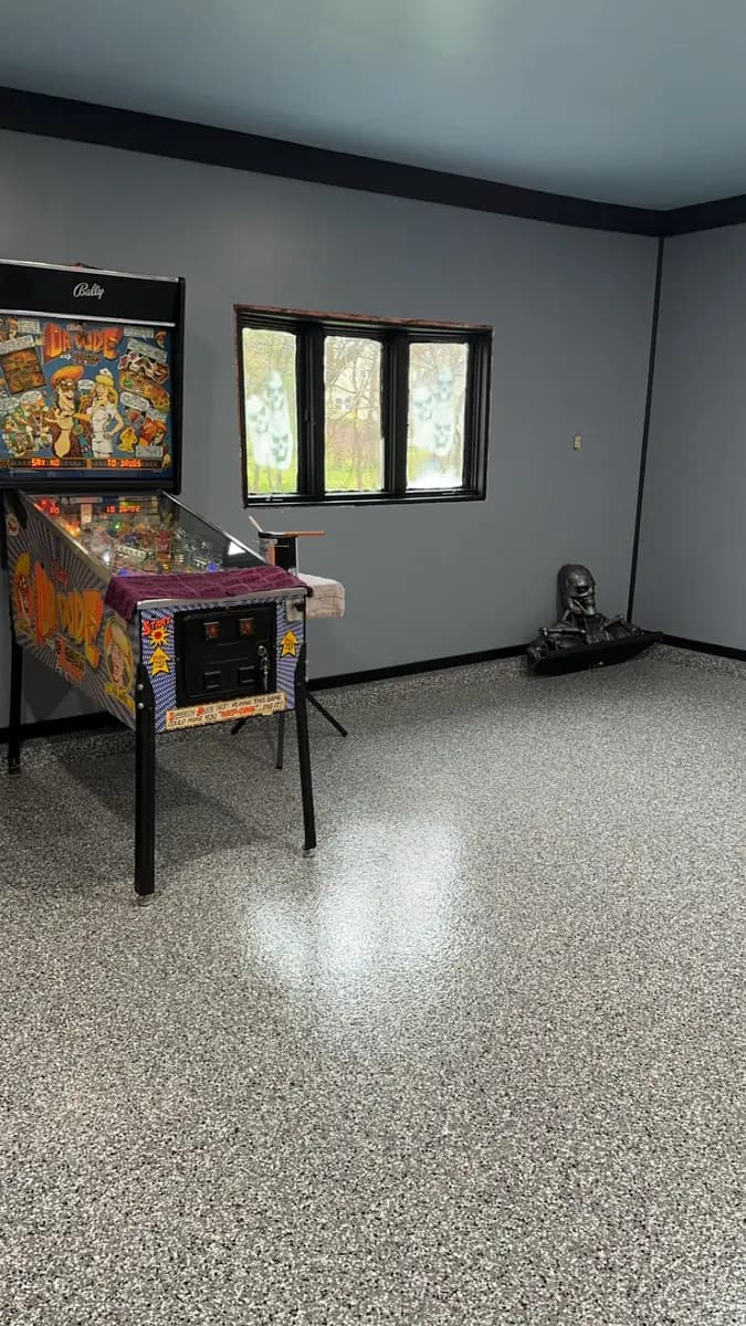 Recreation room with a completed flake epoxy floor.