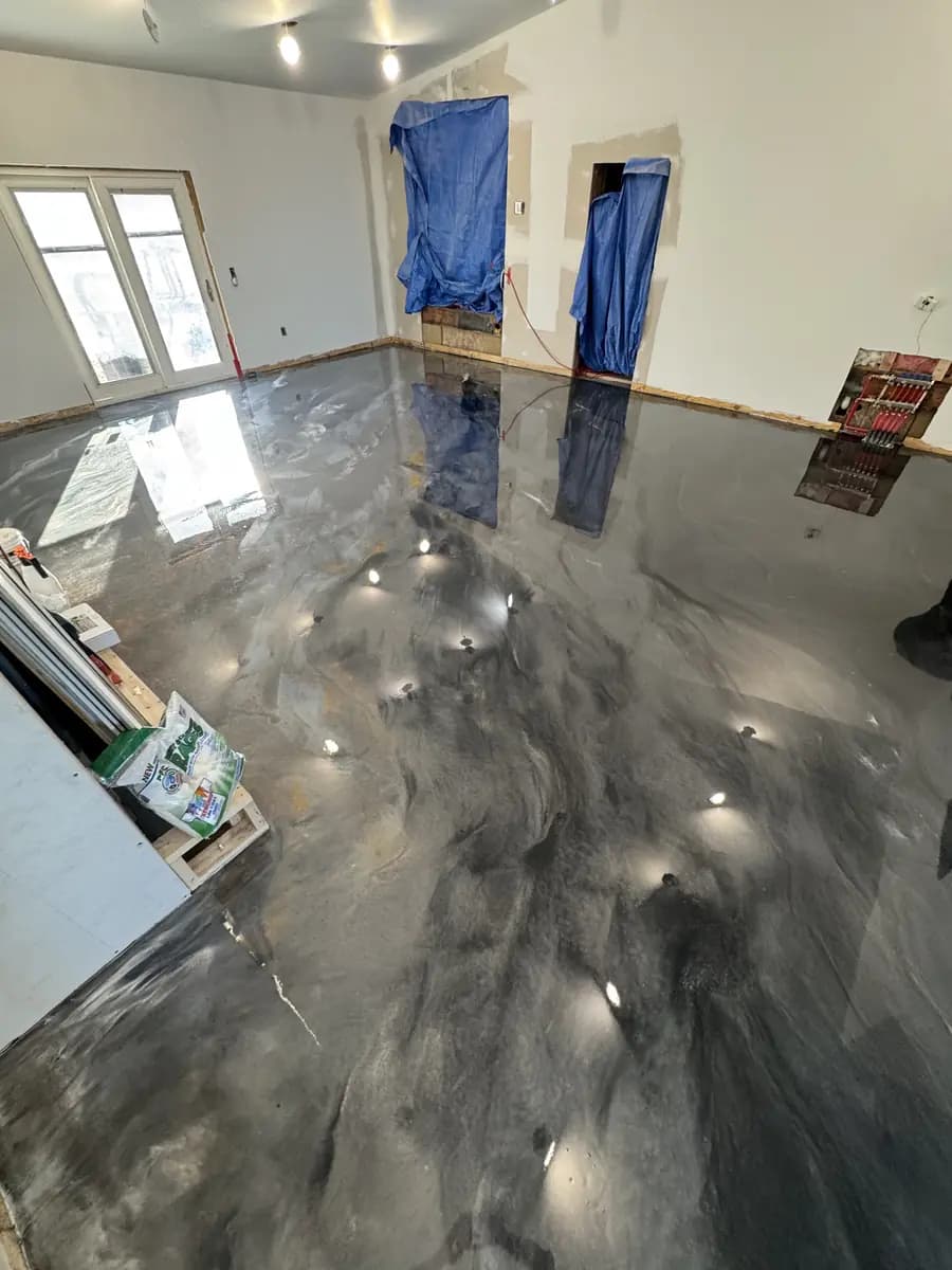 Residential room with a completed reflective metallic epoxy floor.