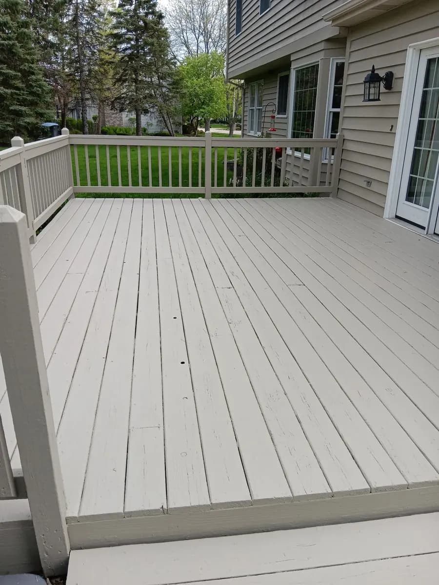 Finished deck boards and railings with a durable neutral coating.