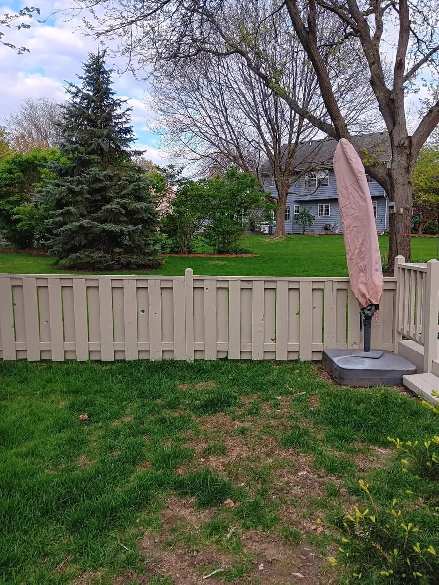 Wide view of the refinished fence with consistent color.
