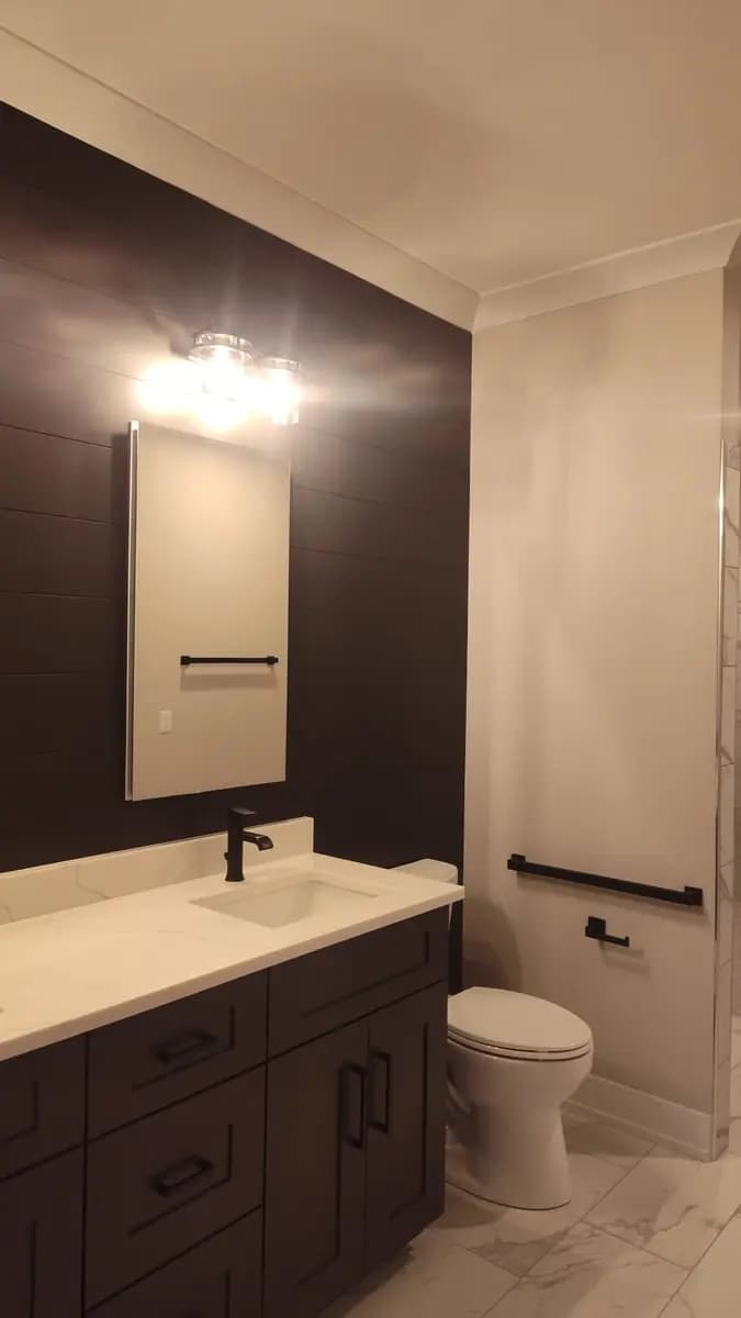 Bathroom accent wall and vanity area after painting.