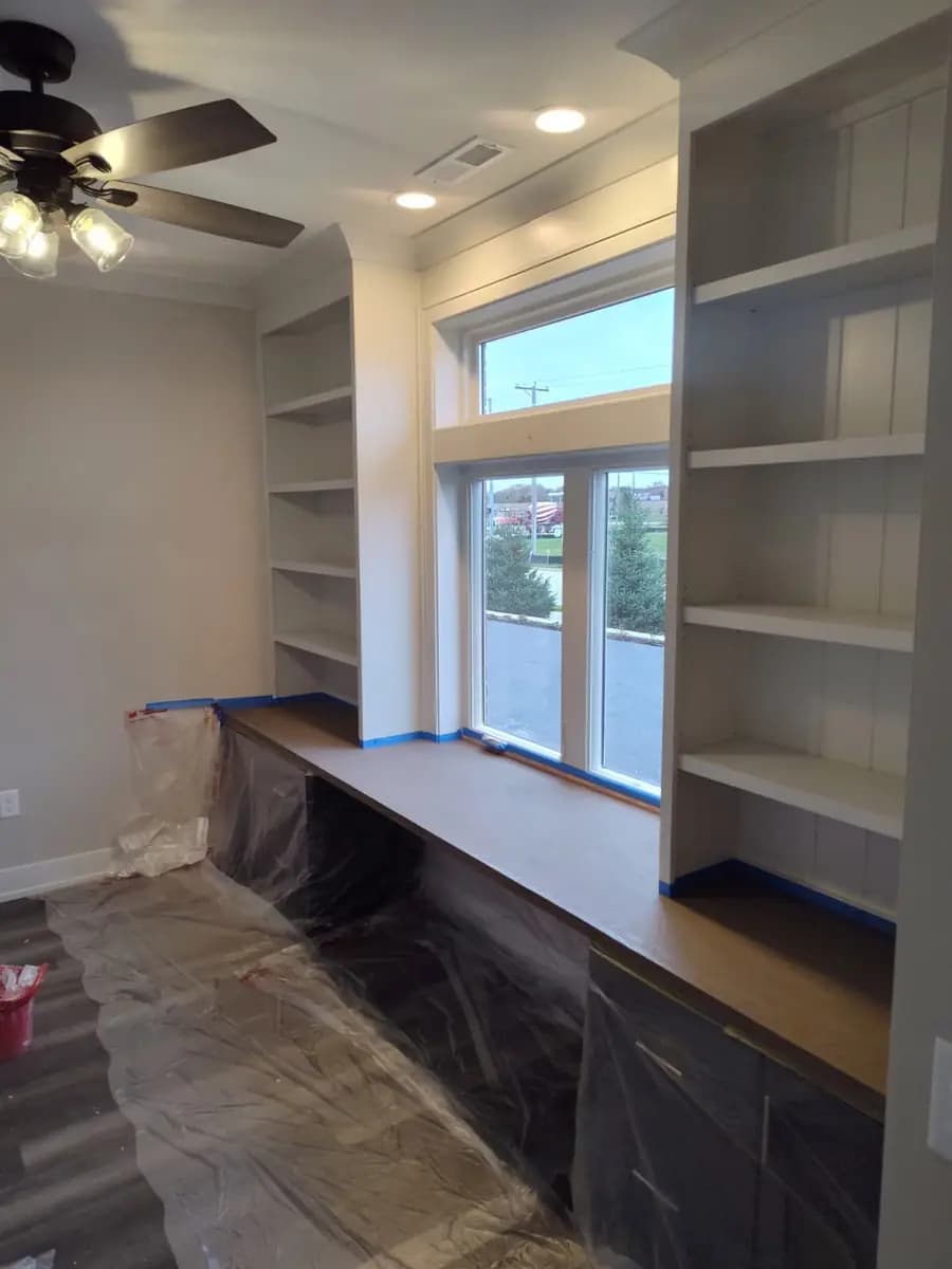 Built-in shelving during painting preparation.