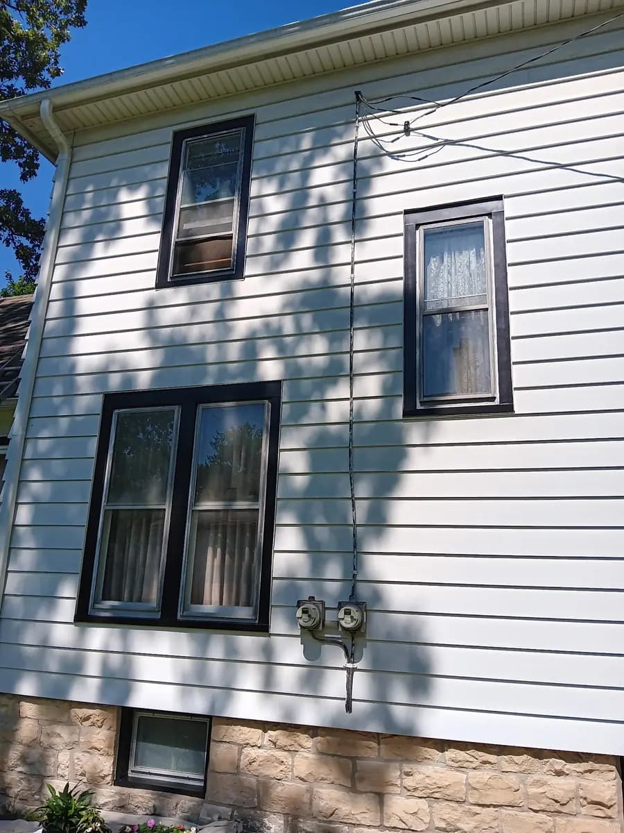 Full side elevation after exterior cleaning and repainting.