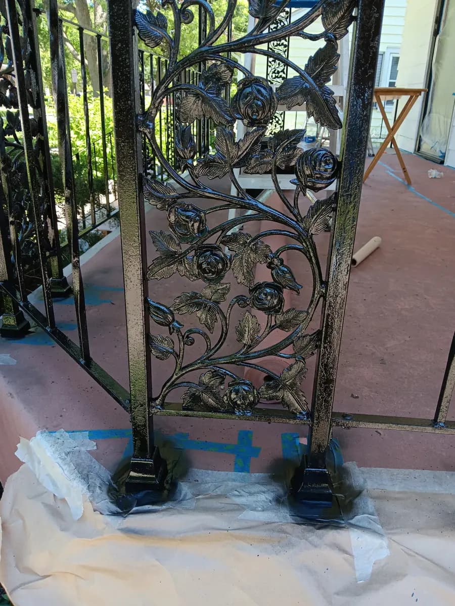 Restored ornamental ironwork on the entry column, close-up.