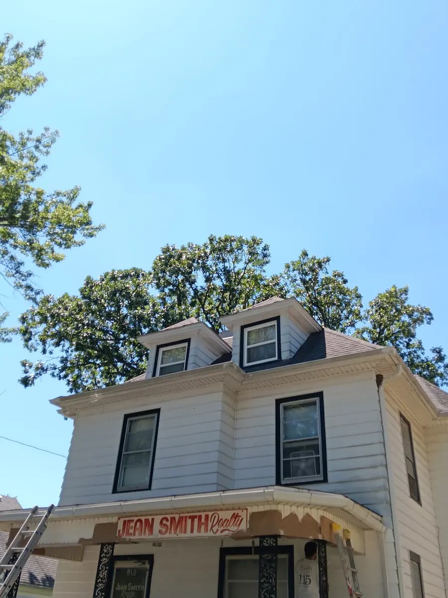 Upper facade and roofline after the exterior repaint.
