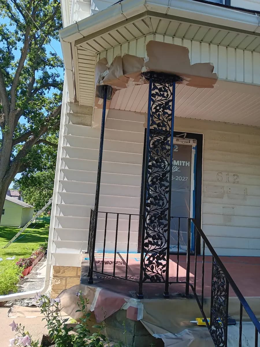 Entry column and canopy trim with restoration and painting still in progress.